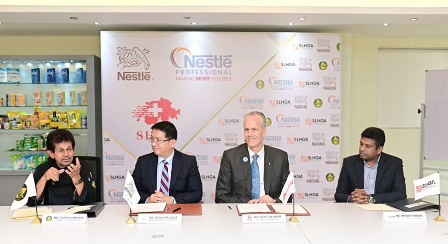 Gerard Mendis Jason Avancena Managing Director of Nestle Lanka PLC Rolf Blaser MD CEO of Baurs and Patrick Pereira VP of SLHGA