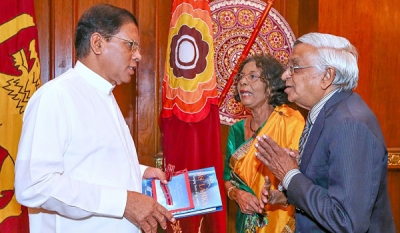 Publisher Vijitha Yapa presents latest book on Sri Lanka to President