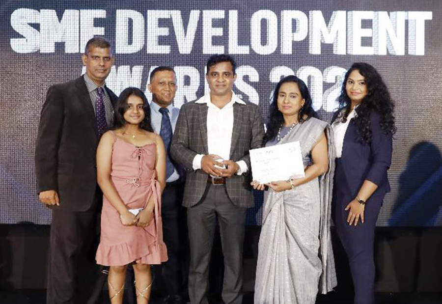 PrintMass Managing Director Janaka Wickramasinghe with the team
