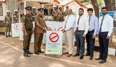 HNB FINANCE donates a consignment of road signboards to Nugegoda Police